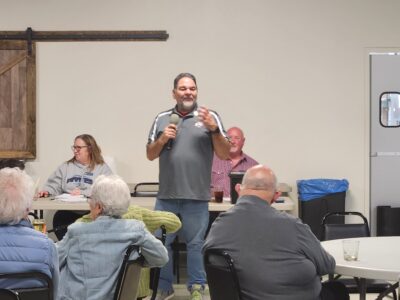 Presenter speaking during a fentanyl awareness workshop with community members in attendance.