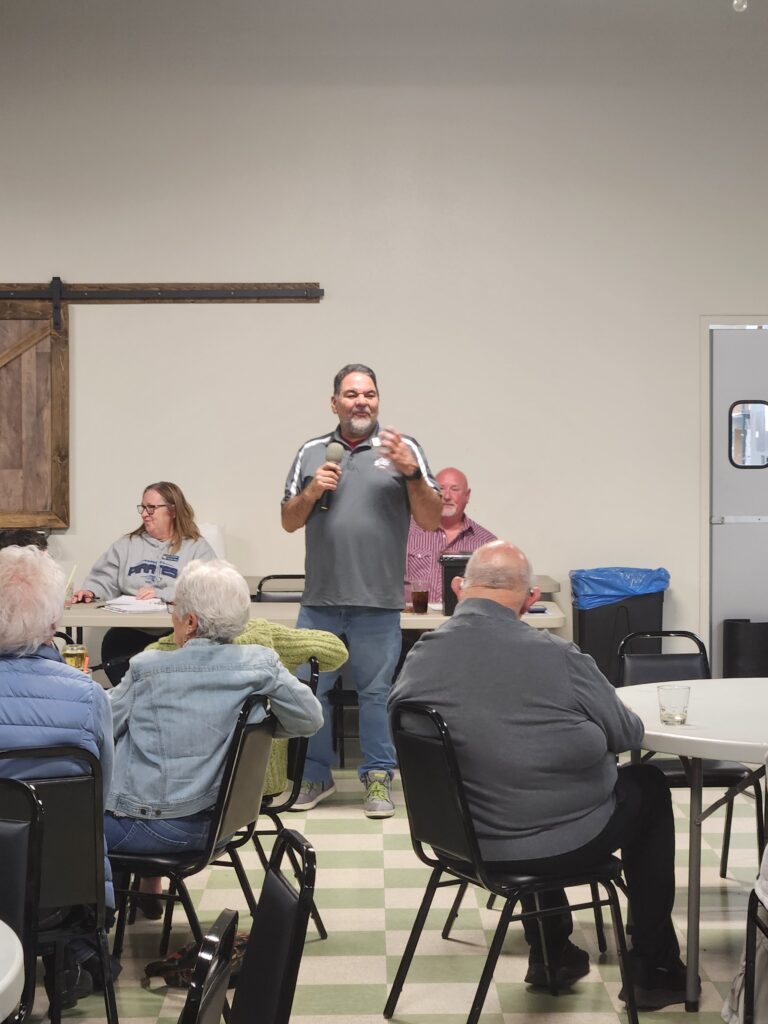 Presenter speaking during a fentanyl awareness workshop with community members in attendance.