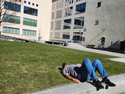 “Presenter resting outside a school in Maine before leading an opioid prevention workshop.”