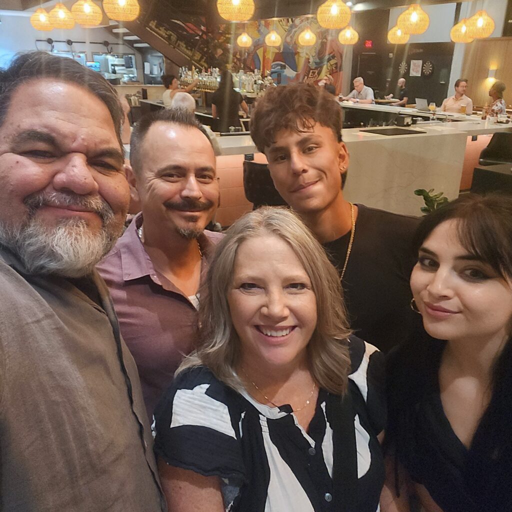 Group photo at dinner during Ray Lozano’s youth drug-prevention travel event.