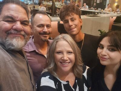 Group photo at dinner during Ray Lozano’s youth drug-prevention travel event.