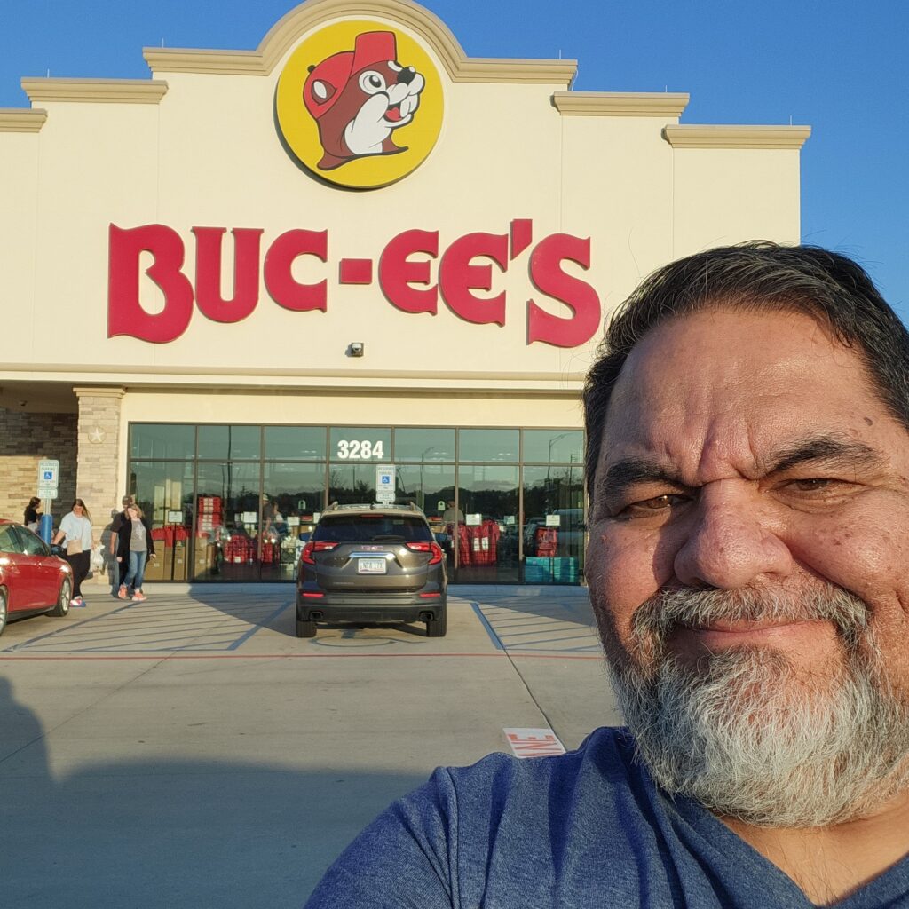 Ray Lozano standing outside a Buc-ee’s in Texas during a youth prevention speaking tour, preparing for a workshop at a nearby high school.