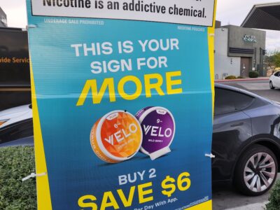 Advertisement for nicotine pouches displayed outside a gas station, used as an example during Ray Lozano’s middle school drug prevention workshop in Ohio.